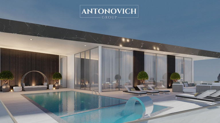 Luxurious Roof Deck Swimming Pool Design with a Sitting Area by Antonovich Group