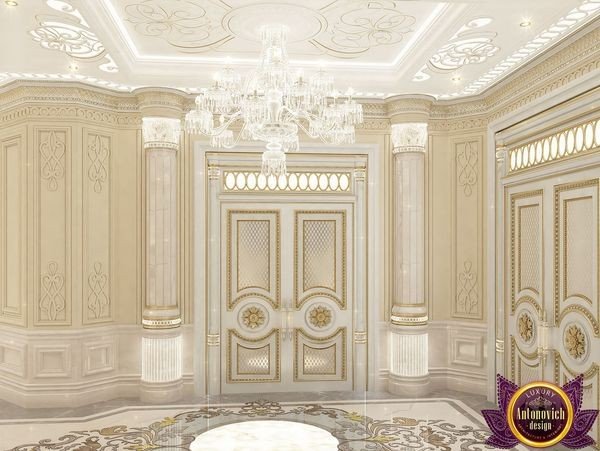 Luxurious entrance hall with marble flooring and gold accents