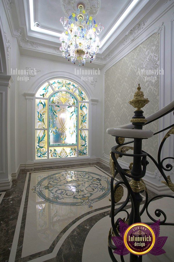 Opulent chandelier illuminating a grand mansion entrance
