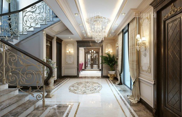Elegant entryway with statement chandelier and marble flooring