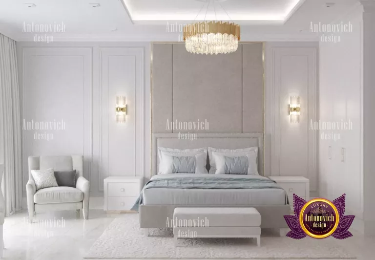 Sophisticated clear white bedroom featuring a stylish chandelier and cozy seating