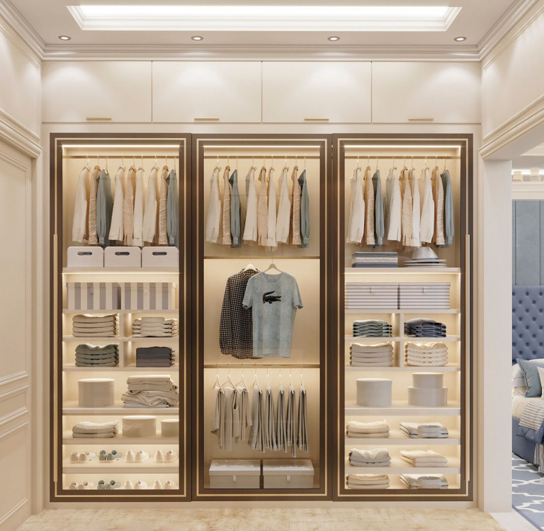 Sophisticated walk-in closet with floor-to-ceiling mirrors and custom cabinetry