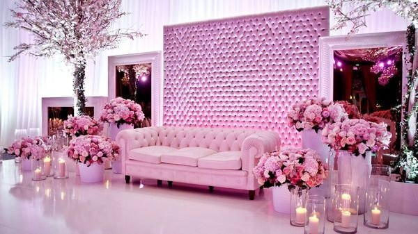 Glamorous luxury wedding reception decor with crystal chandeliers