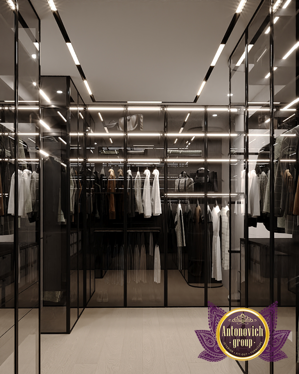 Elegant walk-in closet featuring stylish lighting and high-end finishes