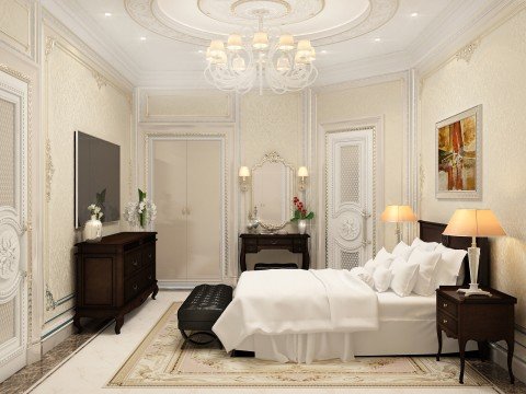 This picture is a rendering of a modern luxurious bedroom designed in a classical style. The bedroom features a king-sized four poster bed with a canopy and intricate, gold-colored posts and detailed molding along the edges. The walls are paneled and adorned with ornate mirrors and wall sconces. The room is illuminated by several stylish yet practical chandeliers and has a parquet floor with an elegant rug. The furnishings and decor are all in shades of ivory, cream, and gold and are enhanced by the subtle lighting.