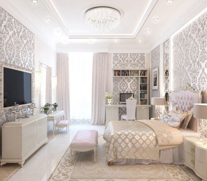 The picture shows a luxurious, contemporary living room featuring a white marble floor and crystal chandelier. The walls are painted a light gray and decorated with a large abstract painting and tall, elegant wall lamps. The seating area has two cream velvet couches arranged around a round glass coffee table, and it is accented by several throw pillows in shades of pink and gold.