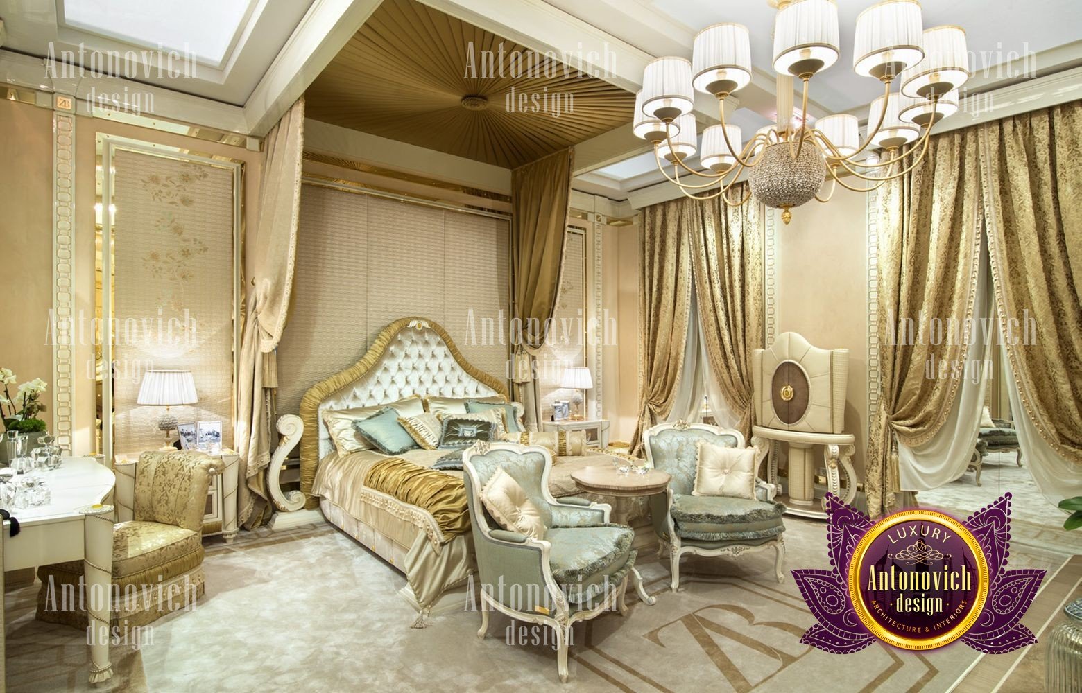 This picture shows a modern and luxurious bedroom designed with an open concept. It features a four poster bed upholstered in blush pink velvet, a tufted headboard, plush white bedding, and gold accents. There is an ornate, mirrored wardrobe to the left, and a set of French doors leading to a private balcony. The walls are painted a soft white, and the floor has a light-colored hardwood finish. A round glass table with a statement lamp sits in front of the bed, and there is a chaise lounge at the foot of the bed.