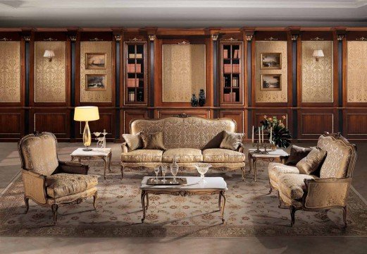 This picture shows a luxurious dining area designed in a modern, geometric style. It features a large crystal chandelier hanging from the ceiling, with several small lights lining the ceiling. A long, dark-stained wooden table is surrounded by comfortable white chairs. The walls are painted a light beige and feature an intricate blue, white and bronze patterned wallpaper. A black and white checkered marble floor adds texture to the room. Finally, two large windows allow natural light to stream into the room, creating a bright, inviting atmosphere.