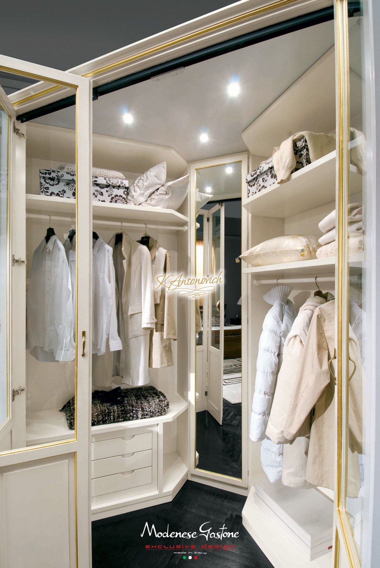 This picture shows a stunning interior design with a modern twist. The room features an elegant gold-trimmed white sofa, intricately patterned light blue and white area rug, contemporary black and gold coffee table, and a beautiful crystal chandelier illuminating the space. The back wall is covered in white and gold wallpaper, while two large windows bring in plenty of natural light.