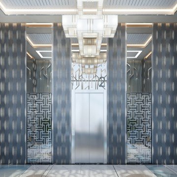 This is a bathroom in an opulent, modern design. The walls are covered in detailed grey and white tile, while the floor features larger porcelain tiles. The washbasin is composed of black marble on the edge and white marble on the countertop. There is a separate area for the shower, with a glass door and silver frame, along with a large rain shower head. At the end of the room, there is a large window and openness to the outside.