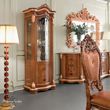 An elegant bedroom design with a classic atmosphere, featuring a tufted headboard, mirrored nightstands, and luxurious velvet upholstery.