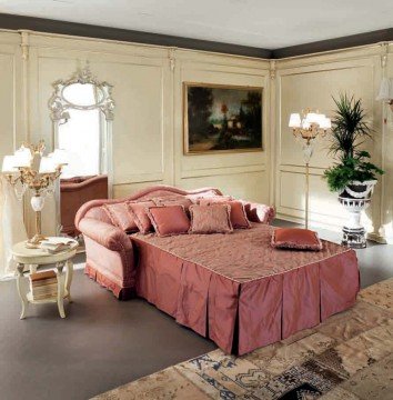 A majestic master bedroom with a luxurious four-poster bed, handmade parquet floors, and crystal chandeliers.