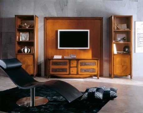 This picture shows an elegant interior design in a large living room. The room has light wood flooring and walls painted in a light blue-gray color. At the center of the room is a red upholstered sofa with white accent pillows, surrounded by two black armchairs, a glass coffee table and a brown ottoman. On the other side of the room is a wall featuring a built-in fireplace, flanked by a pair of tall windows covered with sheer curtains. A round marble dining table and black leather chairs complete the setting.