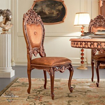 This picture is of an elegantly designed staircase which is made from marble and brass materials. The staircase has a curved, winding shape with ornate brass railings and a grand marble balustrade along the sides for added safety. The steps have been carefully crafted with intricate details to add a luxurious feel to the home. The staircase is illuminated by several warm-tone lights that are integrated into the stair design.