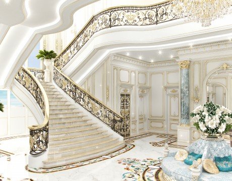 This picture shows an ornate and elegant entrance to a grand abode. The entrance is comprised of several detailed elements, including two marble columns flanking a set of double doors, and a small stairway leading up to the entrance. Above the doors is an intricately carved archway in which there is an inscription written in a foreign language. A warm light from inside the house illuminates the area around the entrance giving it a cozy and inviting atmosphere.