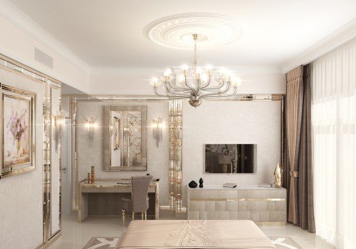 This picture shows a modern living room with a unique and stylish design. The room features an ivory-colored sofa with two dark brown armchairs and an ottoman. In the center of the room is a round glass coffee table surrounded by an ornate rug. On the walls are dark brown wainscoting and two matching abstract paintings. The walls are lit with recessed lighting, and the room has a large window with sheer curtains.