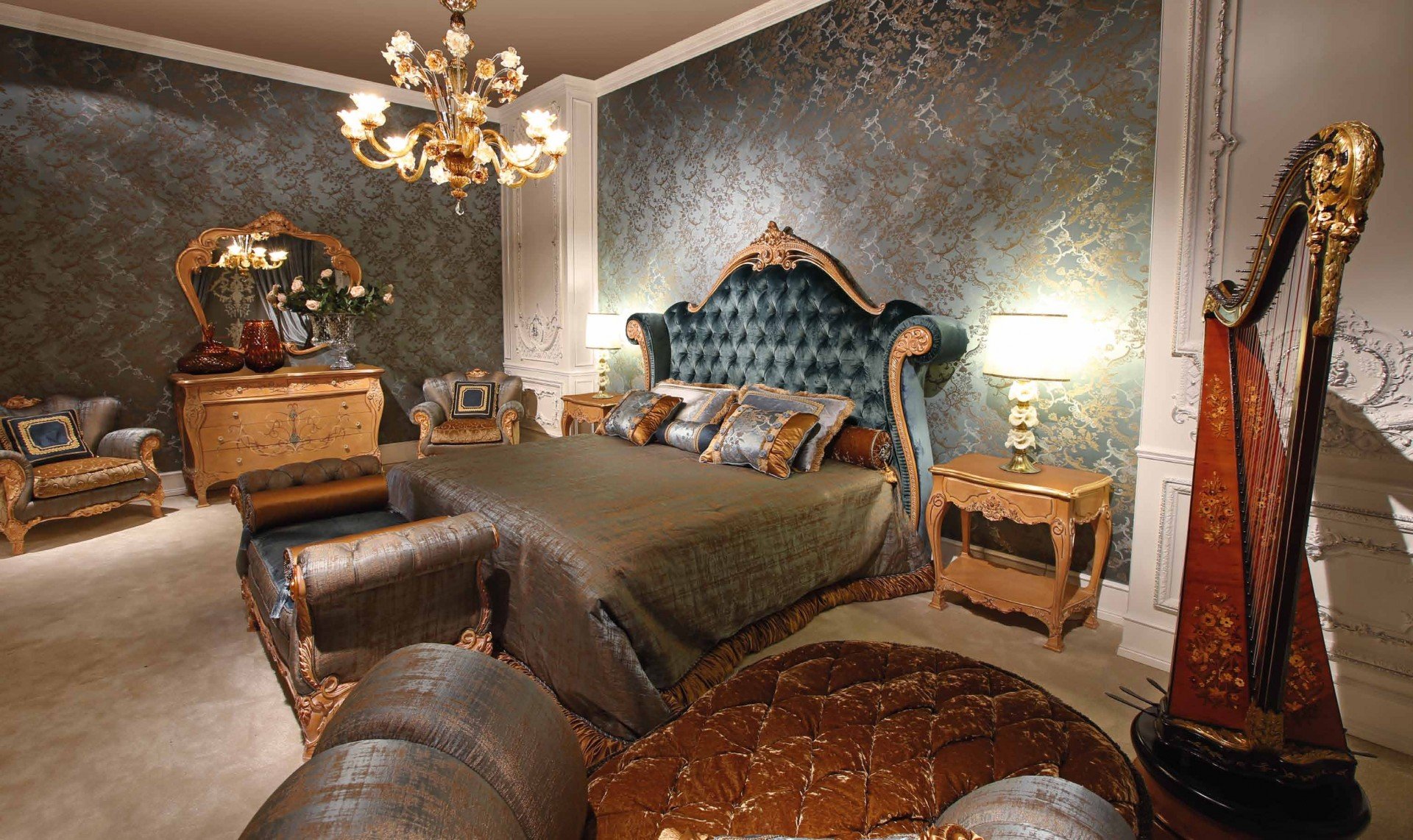 This picture shows an ornately decorated interior space of a room. The walls are covered in elegant ivory wallpaper with intricate gold detailing, and the floor is made of polished black marble with a geometric pattern design. The room is furniture with a round coffee table in the center, two large upholstered chairs on either side and a matching loveseat against one wall. The ceiling features a stunning crystal chandelier, and the walls feature several framed art pieces.