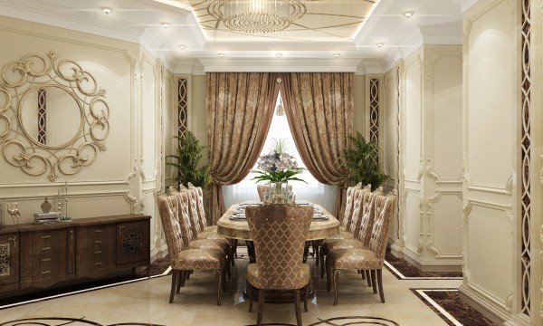 This picture shows an interior design of a luxury bedroom. It features polished hardwood floors, large floor-to-ceiling windows with light grey curtains, and a contemporary white bed frame with a large navy blue headboard. The bed is dressed with an ivory bedspread, numerous decorative throw pillows, including a chenille throw, and a pair of dark grey nightstands. On the wall behind the bed, there is an elegant wall sconce, as well as a scale painting of pink and green florals. On either side of the room can be seen tall dark