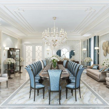 This picture shows an elegant and luxurious dining room. The walls are a soft cream color with a textured wallpaper pattern near the ceiling. The furniture is mostly black, including a large dining table with white chairs, an ornate sideboard, and a bar. There is a crystal chandelier hanging from the ceiling and two grandiose windows that feature sheer curtains. The carpet is a deep blue-green shade, which adds to the regal atmosphere of the space.