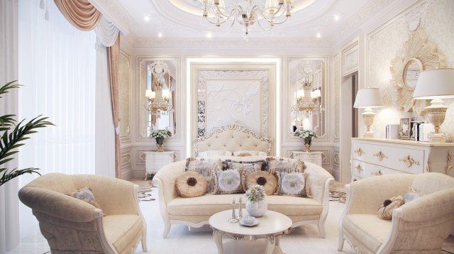 This picture shows a luxurious living room, designed with opulent materials and elegant furniture. The room features a large mirror placed on the wall, adding light and space to the room. A large, plush sofa is the focal point of the room, and two armchairs sit beside it. There is a beautiful crystal chandelier that hangs in the center of the room, and a white marble fireplace is featured across the room. On either side of the fireplace, two tall bookshelves are visible, providing stylish storage for books and decorative items. The walls are painted in an off-white