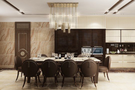 This picture shows a modern-style dining room with a luxurious interior design. The room features a dark wooden dining table set surrounded by six white chairs. There is a large chandelier hanging from the ceiling, providing a soft and warm light to the room. The walls are lined with a patterned wallpaper, while the floor is made of a light-colored wood. The room also features several pieces of art and decor on the walls, creating a stylish and inviting atmosphere.