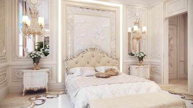 A luxury modern bathroom with gold details, white marble and a glass waterfall shower.