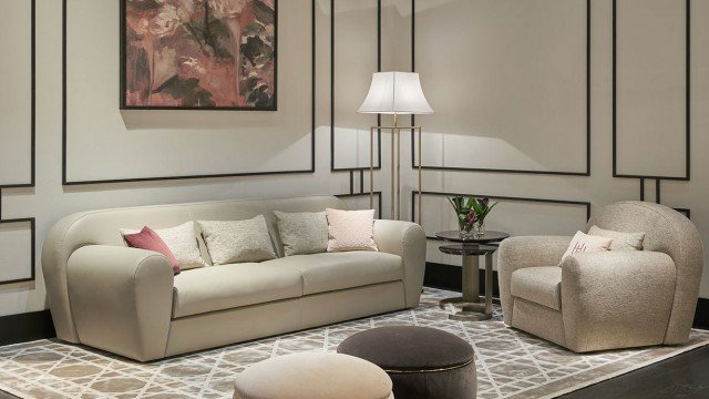 A stunning luxury Italian sofa in pastel pink and gold upholstery. Perfect for any room.