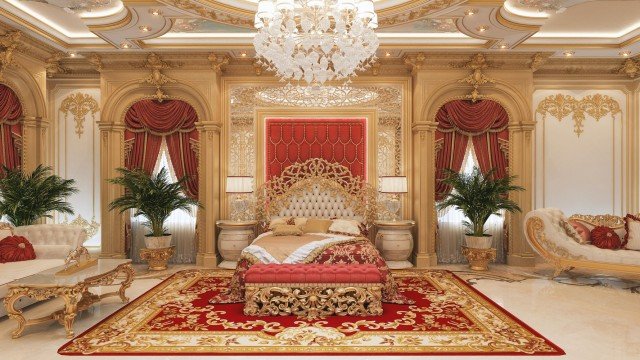 A beautiful luxurious bedroom with an abundance of gold, a grand crystal chandelier, and exquisitely designed furniture.