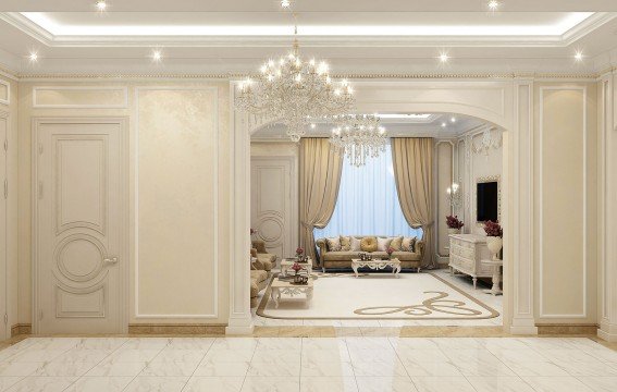 This picture shows a grand entrance hall in a luxurious home. The walls are adorned with golden accents, marble pillars and a large crystal chandelier. There is a beautiful red and gold carpet that covers most of the floor, as well as two comfortable armchairs which adds a nice touch. Large double doors can be seen in the back, which presumably leads to other rooms in the house. Overall, this design exudes a sense of luxury and class.