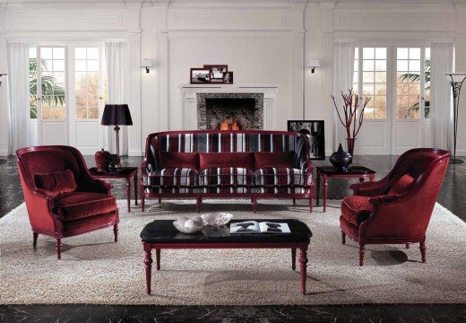 A modern living room design featuring an amber yellow sofa, a crystal chandelier and abstract art for a luxurious aesthetic.