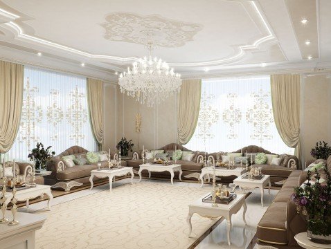This picture shows a beautiful contemporary living room with a sleek black sofa and matching modern armchairs. There is a luxurious patterned rug on the floor, and the walls feature a unique pattern of light gray and white wall paneling. An elegant crystal chandelier hangs from the ceiling and there are two round accent tables with decorative lamps on either side of the sofa. A large mirror is hung on the wall above the couch, and a painting adds a touch of color to the otherwise neutral palette.