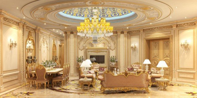 This picture shows a beautiful and luxurious entryway to a home. The walls are a glossy white marble with a black marble floor, and the ceiling has an intricate gold and white patterned design. The walls are adorned with elegant, brass sconces on either side of the doorway, and at the center is a large and ornate door with a gold handle. To the right of the door is a striking fountain in front of a wall of lush green plants.