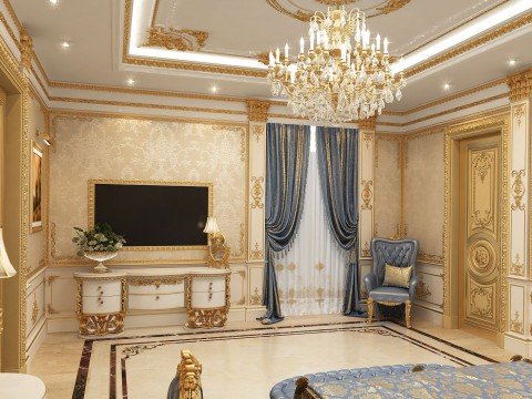 This picture shows a luxurious living room with high ceilings and ornate furniture. The room is full of modern and traditional details, including a large crystal chandelier, gilded cornices and trims, and intricate wallpaper. The walls are painted a deep cream color, while the furniture is upholstered in gold fabric, giving the room an aura of luxury and sophistication.