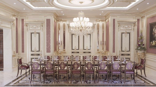 This picture shows an elegant and luxurious dining room. It features a grand dining table with six chairs, along with a beautiful crystal chandelier hanging from the ceiling. The walls are adorned with striped wallpaper in a grey-blue color, while the floors are covered with a light marble. The space is also decorated with several potted plants, giving the area a refreshing feel.