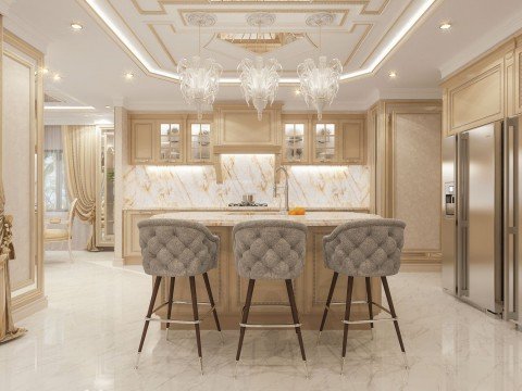 This picture shows a luxurious modern living room with a unique design. The room is decorated with an elegant beige sofa, two matching armchairs, and an ornate center table. The walls are decorated with mirrored panels and intricate golden accents, adding richness to the room. A large, beige rug covers the floor, and a tall plant stands in one corner for added decoration. There is a white mantelpiece along the wall which serves as both a focal point and a practical shelf, and a white-framed artwork hangs above it.