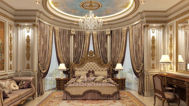 This picture shows a luxurious living area with a modern white sofa set, an ornate white coffee table, and two beige armchairs. The area is decorated with a palette of warm colors, including yellow and red accent pillows and a beige carpet. The walls are adorned with gold framed artwork and there is a grand gold chandelier hanging from the center of the room.