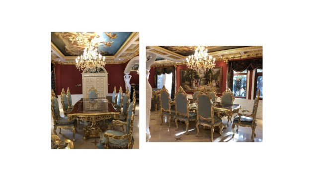 This picture shows a luxurious modern stairwell in a building. The stairs have a bright white marble finish, with white walls and ornate golden trim. The walls have small sconces lined up in a row on each side for additional lighting, and glass panels are lined up along the railing for a more elegant look. At the top of the stairs, there is a black chandelier hanging from the ceiling.