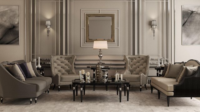 The picture shows a modern contemporary living room. The walls are painted in a light grey color and feature a large painting on the wall. The furniture is upholstered in a white linen, with the sofa and chairs featuring accent cushions in a variety of colors. A black and white area rug is layered on top of a darker flooring, completing the look. There are multiple tables and lighting fixtures to create a comfortable and inviting atmosphere.