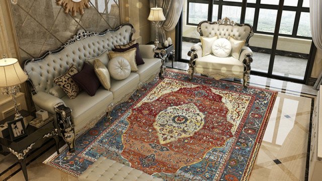 This picture shows a modern living room with high ceilings, large windows, and luxurious furnishings. The space is decorated in shades of beige and white, with a white leather couch, an upholstered armchair, a contemporary coffee table, and a patterned area rug. The walls are adorned with artwork and the room is flooded with natural light. A grand, winding staircase leads up to a balcony overlooking the space.