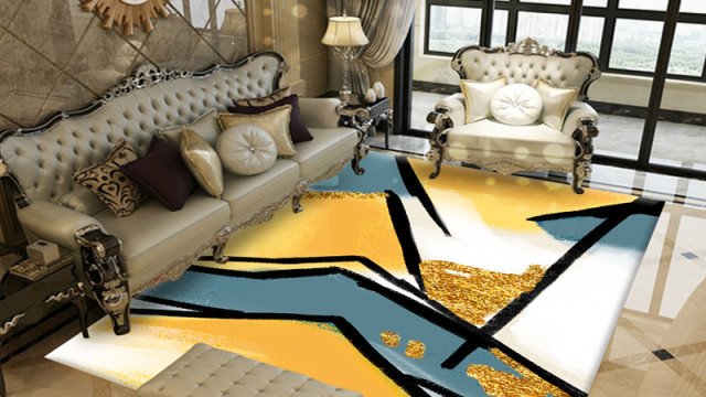 This picture shows an elegant, modern living room that has been designed by Antonovich Design. The room features a modern gray sofa and a large rug on the floor. There is a white end table with a glass top and two stylish armchairs in the corner. The walls are painted white and there is a large abstract painting on one wall. The room also features a beautiful chandelier, which gives the room an inviting ambiance.