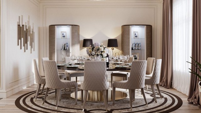 The picture shows a luxurious living room with a contemporary design. The room is decorated in shades of ivory and cream with dark brown accents. The walls are painted in a light ivory color, while the ceiling is lined with dark wood panels. In the center of the room is a large crystal chandelier that provides ambient lighting. The furniture is a combination of dark brown leather couches and chairs with ornate gold detailing. There is also a glass table with two chairs. The floor is tiled in an ivory marble pattern. The room is completed with plants and decorative objects.