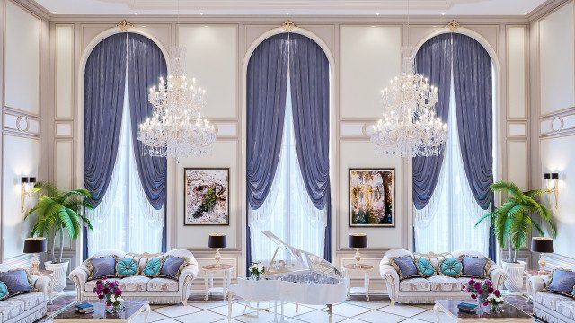 A luxurious, modern living room featuring a large, U-shaped sectional sofa with velvet upholstery and gold accents; accented by recessed lighting and a grand chandelier.