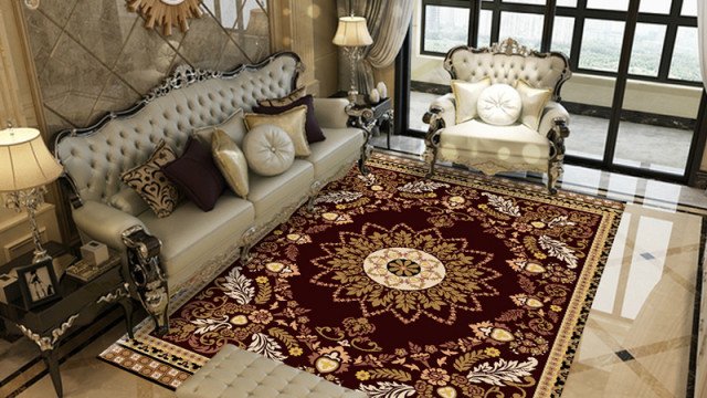 This picture shows a modern luxury dining room designed by Antonovich Design. The space features a large wooden table surrounded by white chairs, with an eye-catching chandelier hanging above it. The walls are covered in a white patterned wallpaper, and the floors are covered in a plush rug. On either side of the table are two units for displaying decorative items such as plants, books, and artwork. The overall look is one of opulence and sophistication.