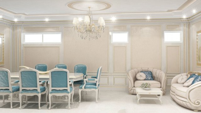 This picture shows an elegant modern living room designed by Antonovich Design. The room features a white and gold theme, with light-colored furniture and plush cream upholstery. The walls are painted light grey and gold patterned wallpaper adds a touch of luxury to the room. An elaborate grand chandelier hangs from the high ceilings of this space, and a large decorative mirror is mounted on one of the walls. The floor is covered in a plush white rug, and subtle gold accents bring the room together for a luxurious yet cozy atmosphere.