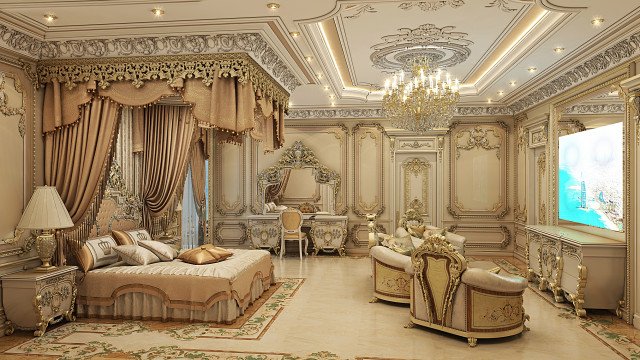 This picture is of a luxurious bedroom designed by Antonovich Design. The room features a large bed with a gold-framed headboard and several decorative pillows, as well as two upholstered armchairs in a deep blue hue. The walls are a pale yellow tone, and several pieces of art can be seen hanging on them. A crystal chandelier hangs in the center of the room, providing a soft light throughout. The floor is covered in a dark gray carpet, which ties the whole scene together.