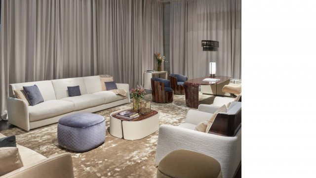 A luxurious bedroom interior featuring dramatic marble walls, a crystal chandelier, and a velvet-lined bed with majestic golden accents.