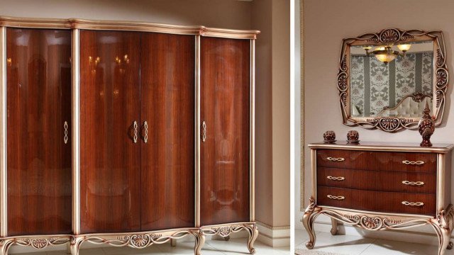 This picture shows a luxurious modern hallway featuring elegant white marble flooring, walls lined with ornamental moldings and elaborate wainscoting, and grand spiral stairs adorned with golden banisters.