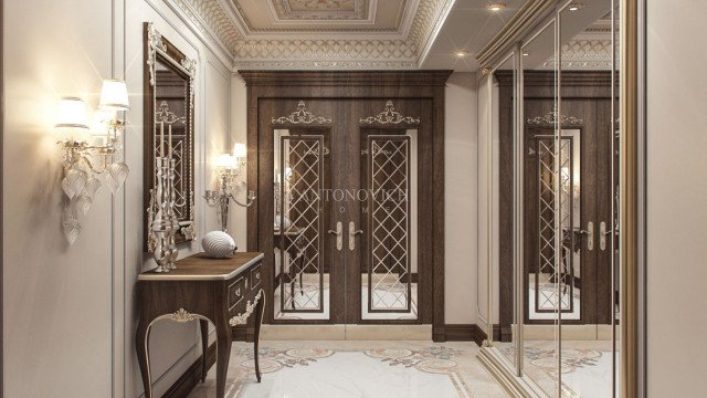 This picture shows a luxurious modern interior design with intricate details. The room features a marble floor, beige walls, and crystal chandeliers to create an elegant and sophisticated ambiance. There is a large white leather sofa with gold accents in the center, as well as a round glass coffee table. There is also a grandiose fireplace with polished marble mantelpiece, alongside a beautiful wall cabinet with glass doors.