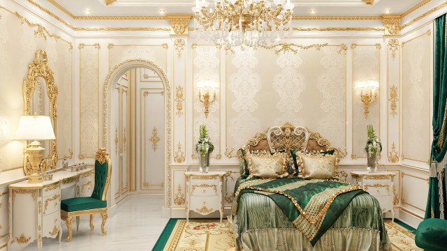 The picture shows a luxurious bedroom with white walls, light hardwood flooring, and an ornately decorated ceiling. The bed is covered in a rich burgundy velvet with white and gold pillows, and the walls are adorned with stunning artwork. There is also a chaise lounge in the corner, a carved marble fireplace, and two side tables with decorative lamps. On the floor next to the bed is a plush rug with a floral design.