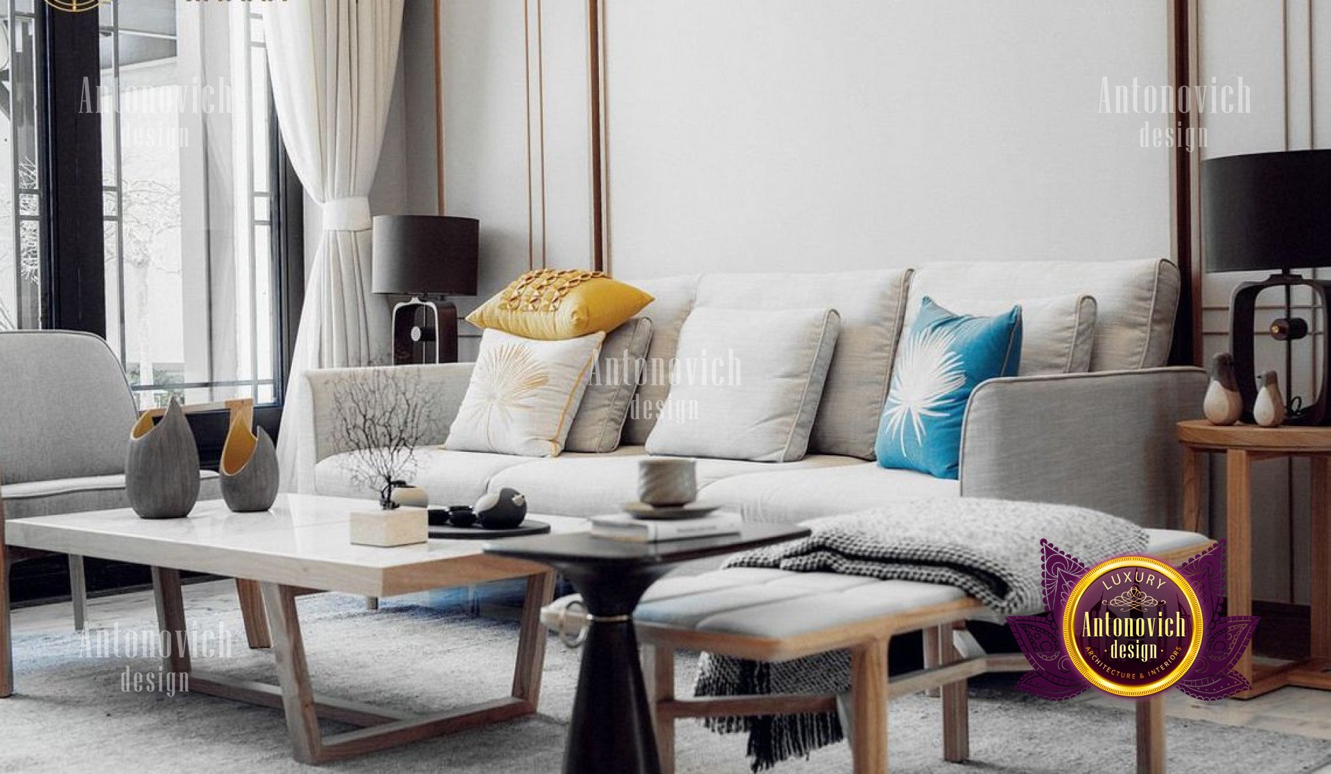 This is a photograph of an elegant contemporary living room. It features smooth white walls, a white sofa, black chairs, and a white accent wall with an interesting geometric pattern. The furniture is finished in shades of black and white, complimenting the color scheme of the room. The white sofa is set on a striking black and white patterned rug that brings texture and depth to the design. The back wall features a tall black bookcase filled with books and decorative objects, adding visual interest and character to the room. In addition, floor to ceiling windows and glass doors allow for plenty of natural